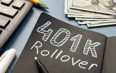 401k rollover written on paper