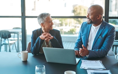 Working Professionals talking at table